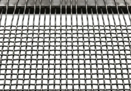 Close-up of precise square apertures on a heavy-duty crimped wire screening panel